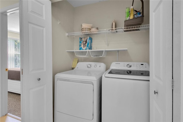 laundry room featuring washer and clothes dryer and laundry area