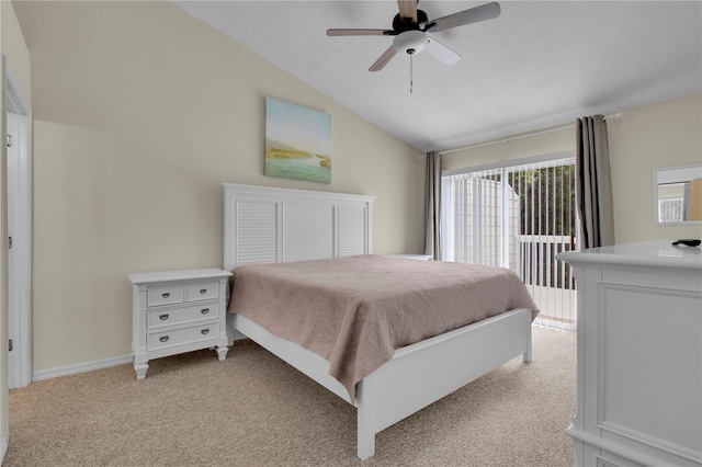 bedroom with ceiling fan, lofted ceiling, and light carpet