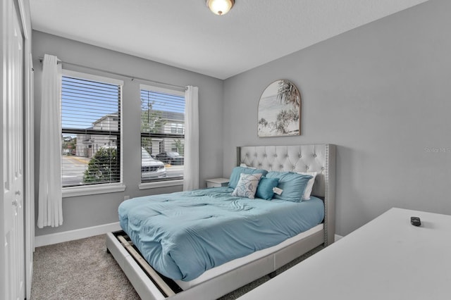 bedroom with light colored carpet