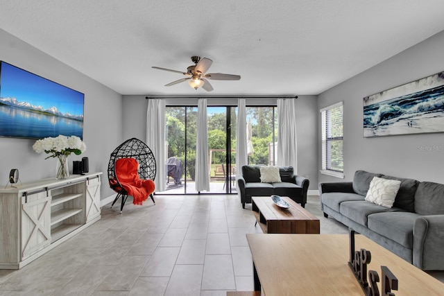 living room featuring light tile patterned floors and ceiling fan