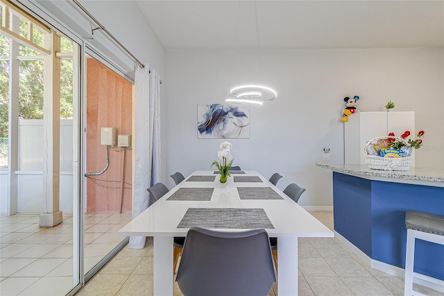 dining area with light tile patterned flooring