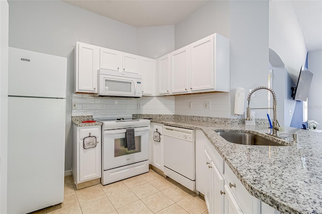 kitchen with white cabinets, white appliances, tasteful backsplash, and sink