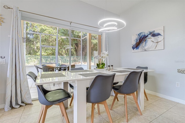 tiled dining room with a healthy amount of sunlight