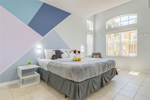 tiled bedroom with a textured ceiling