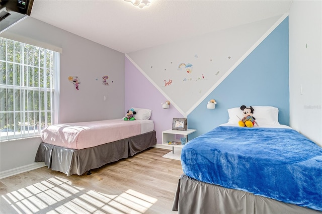 bedroom with light hardwood / wood-style floors