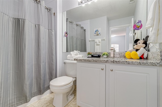 bathroom with tile patterned flooring, vanity, toilet, and curtained shower