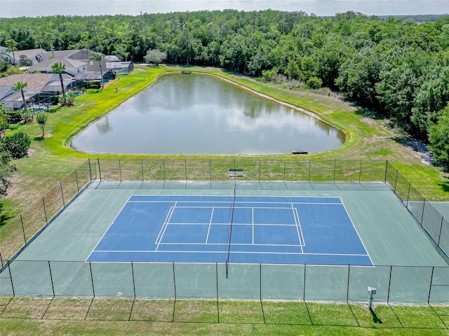 view of sport court featuring a water view