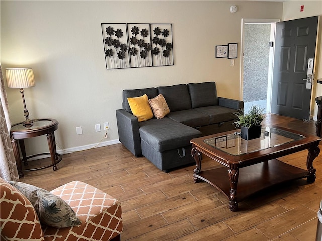 living room with light wood-style floors and baseboards