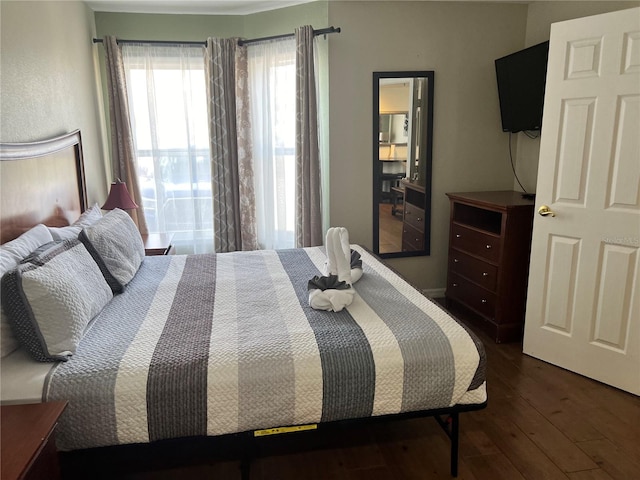 bedroom featuring dark hardwood / wood-style floors