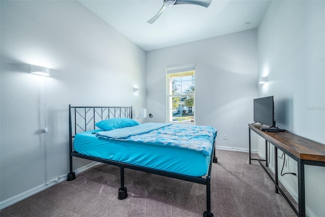 carpeted bedroom with ceiling fan and vaulted ceiling