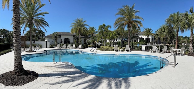 view of swimming pool with a patio area