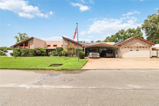 view of front of home with a front yard, solar panels, a garage, and a carport