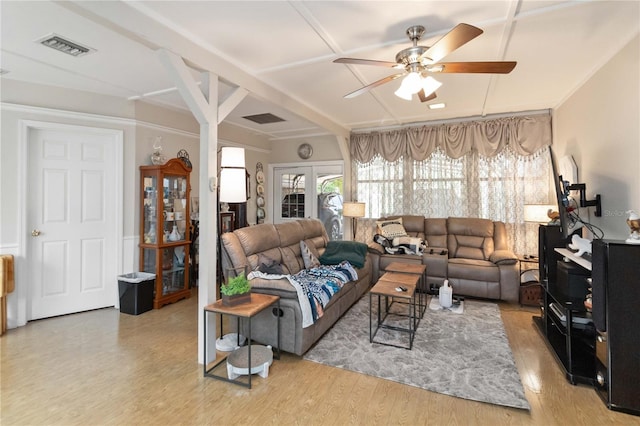 living room with ceiling fan, light wood-type flooring, and french doors