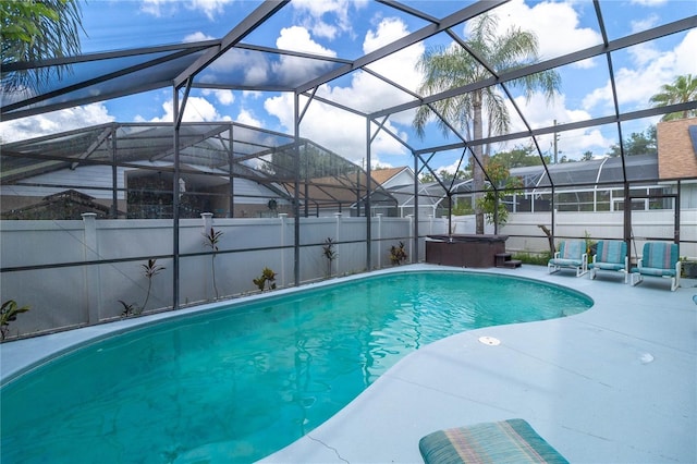 view of pool with a patio, a hot tub, and a lanai