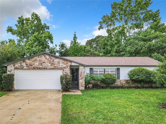 ranch-style home with a front yard and a garage