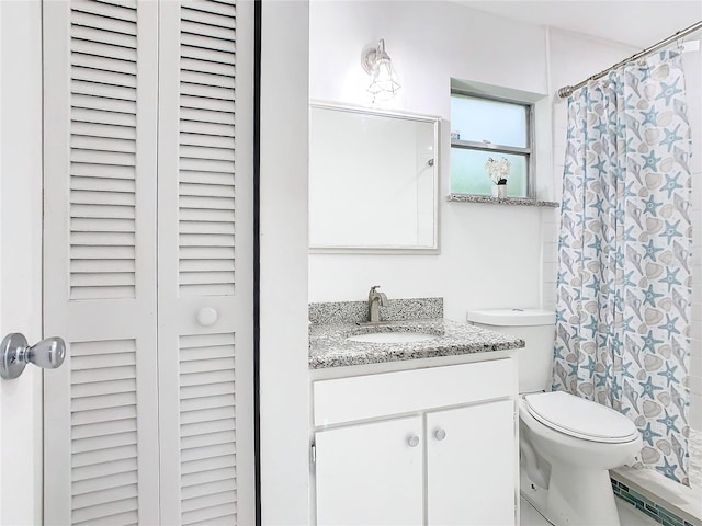 bathroom with baseboard heating, vanity, toilet, and a shower with curtain