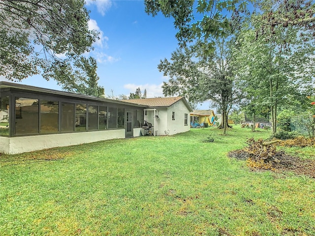 view of yard with a sunroom