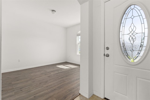 entryway with dark wood-type flooring