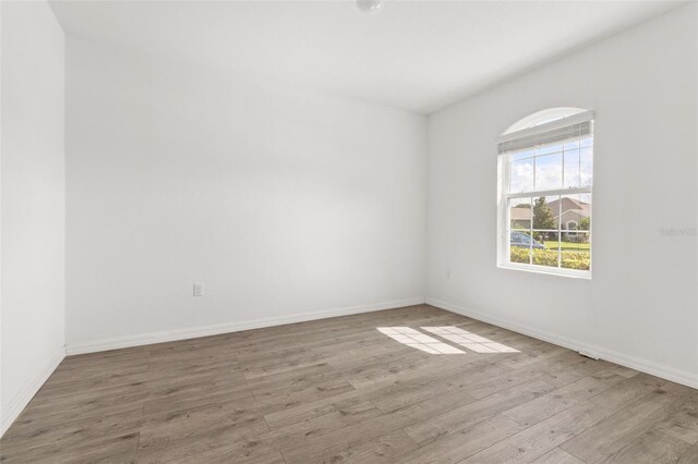 spare room with light hardwood / wood-style floors