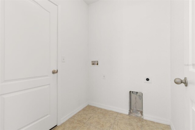 laundry room with washer hookup, light tile patterned floors, and hookup for an electric dryer