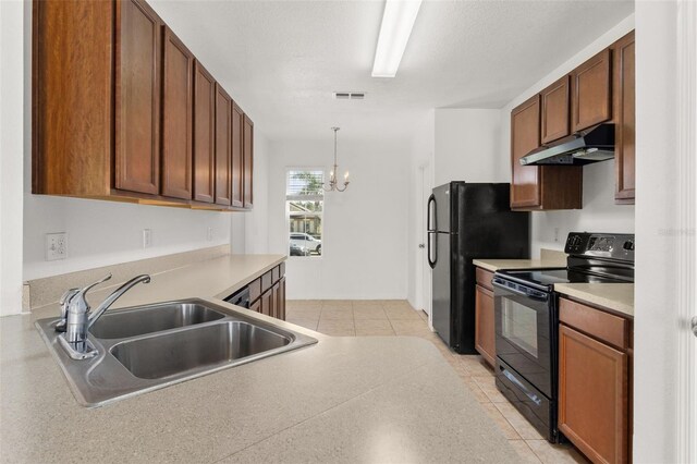 kitchen featuring an inviting chandelier, decorative light fixtures, sink, black appliances, and light tile patterned flooring