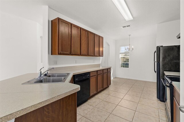 kitchen featuring pendant lighting, a chandelier, electric range oven, sink, and black dishwasher