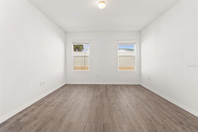 empty room featuring hardwood / wood-style floors