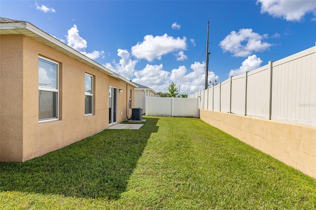 view of yard featuring cooling unit and a fenced backyard