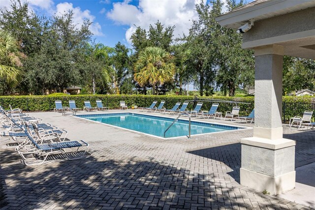 view of swimming pool featuring a patio