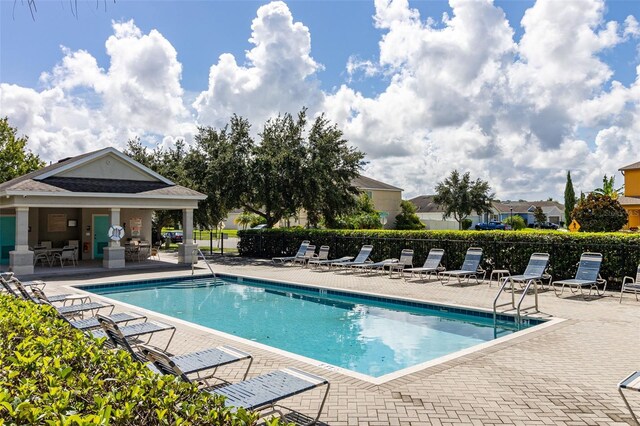 view of swimming pool with a patio area