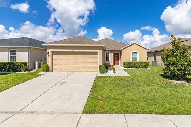 ranch-style house with cooling unit, a front yard, and a garage