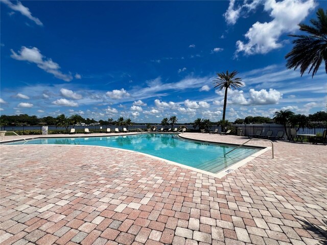 view of swimming pool with a patio area