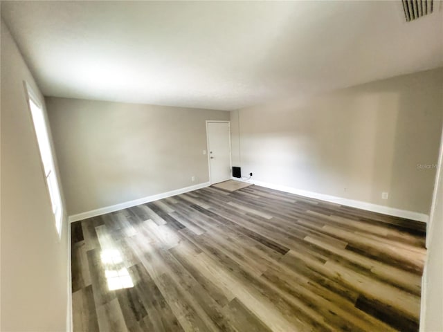 empty room with wood-type flooring