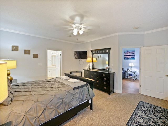 carpeted bedroom featuring ceiling fan, ornamental molding, and ensuite bathroom