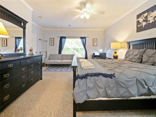 carpeted bedroom featuring crown molding and ceiling fan