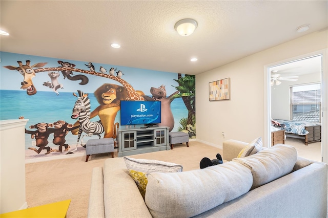 living room with a textured ceiling, ceiling fan, and carpet