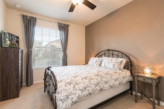 carpeted bedroom with lofted ceiling and ceiling fan