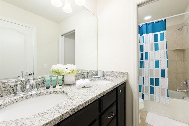 full bathroom featuring tile patterned flooring, vanity, toilet, and shower / bathtub combination with curtain