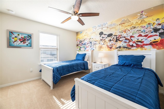 bedroom featuring ceiling fan and light carpet