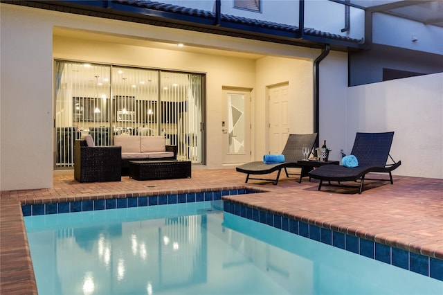 view of pool featuring a patio