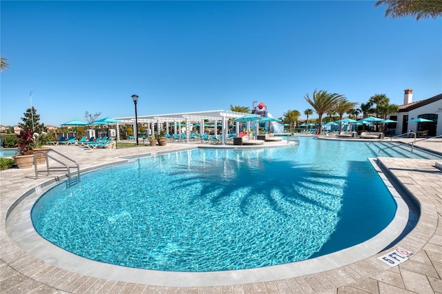 view of swimming pool with a patio