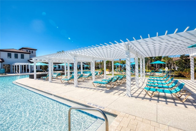 view of swimming pool featuring a patio and a pergola