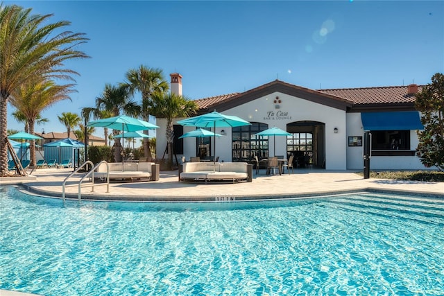 view of pool featuring a patio area