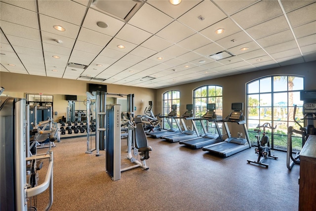 workout area featuring a paneled ceiling