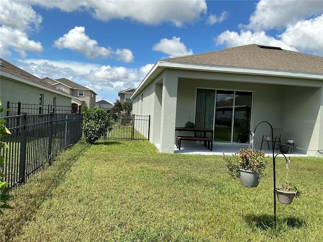 view of yard featuring a patio area and a fenced backyard