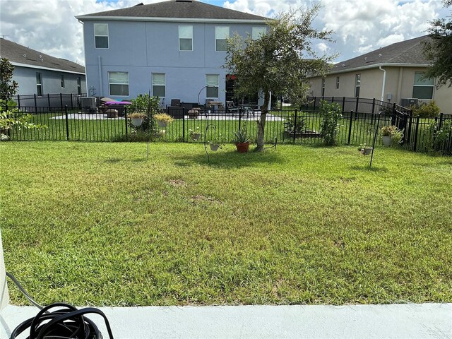 view of yard with central air condition unit