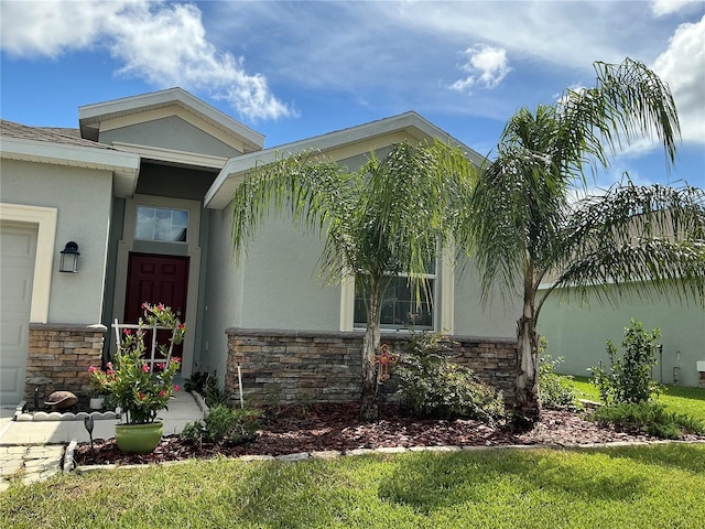 4183 Cortland Dr, Davenport, FL 33837 - doorway to property featuring stucco siding and stone siding