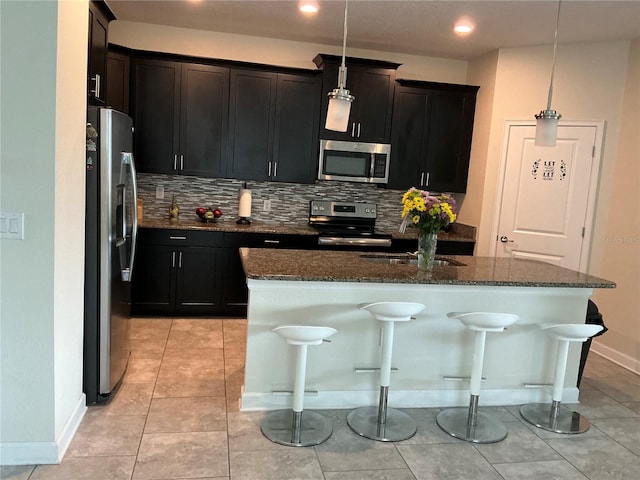 4183 Cortland Dr, Davenport, FL 33837 - kitchen featuring a sink, appliances with stainless steel finishes, backsplash, and dark stone counters