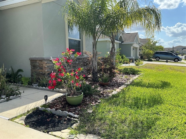4183 Cortland Dr, Davenport, FL 33837 - view of side of home with stucco siding and a yard