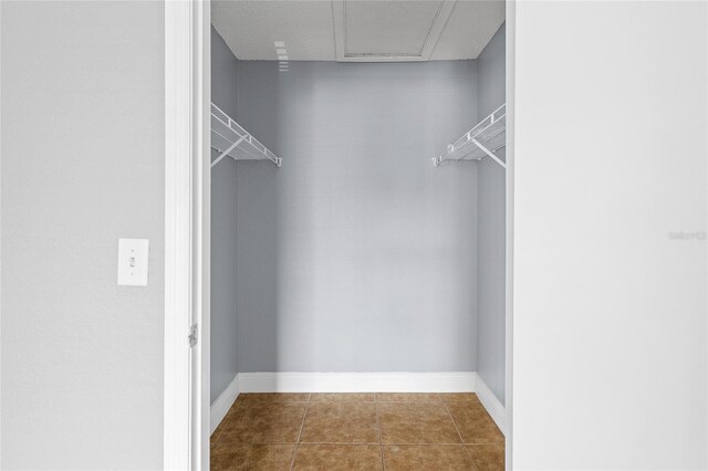 2217 Grand Cayman Ct Unit 1233, Kissimmee, FL 34741 - spacious closet featuring tile patterned flooring